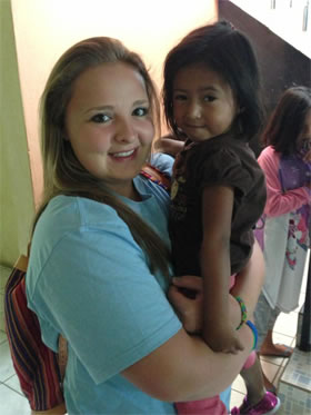 Passport Health Featured Traveler: Mikayla with local children