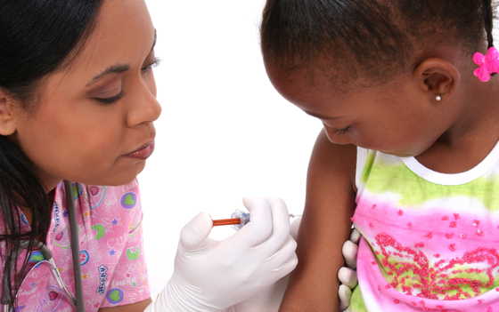 Child Receiving vaccination from a nurse