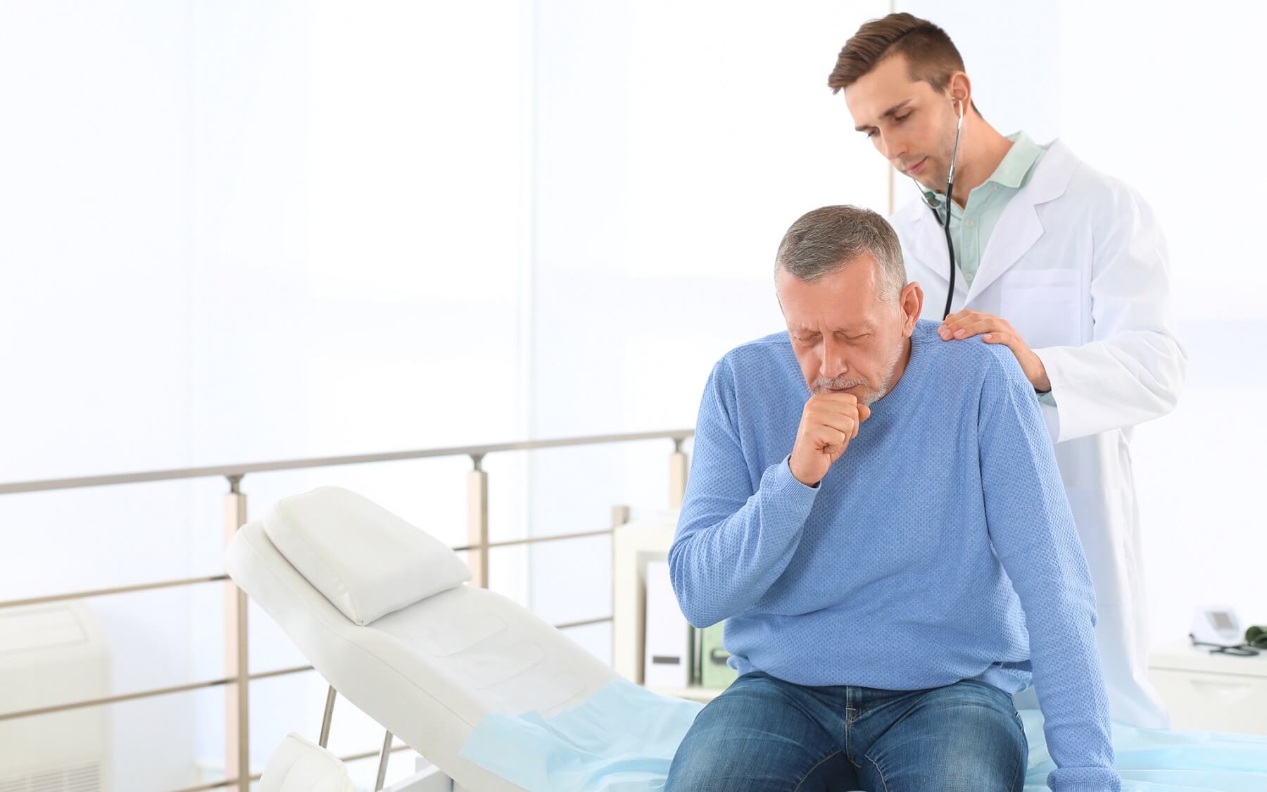 Patient getting a lung exam from a doctor